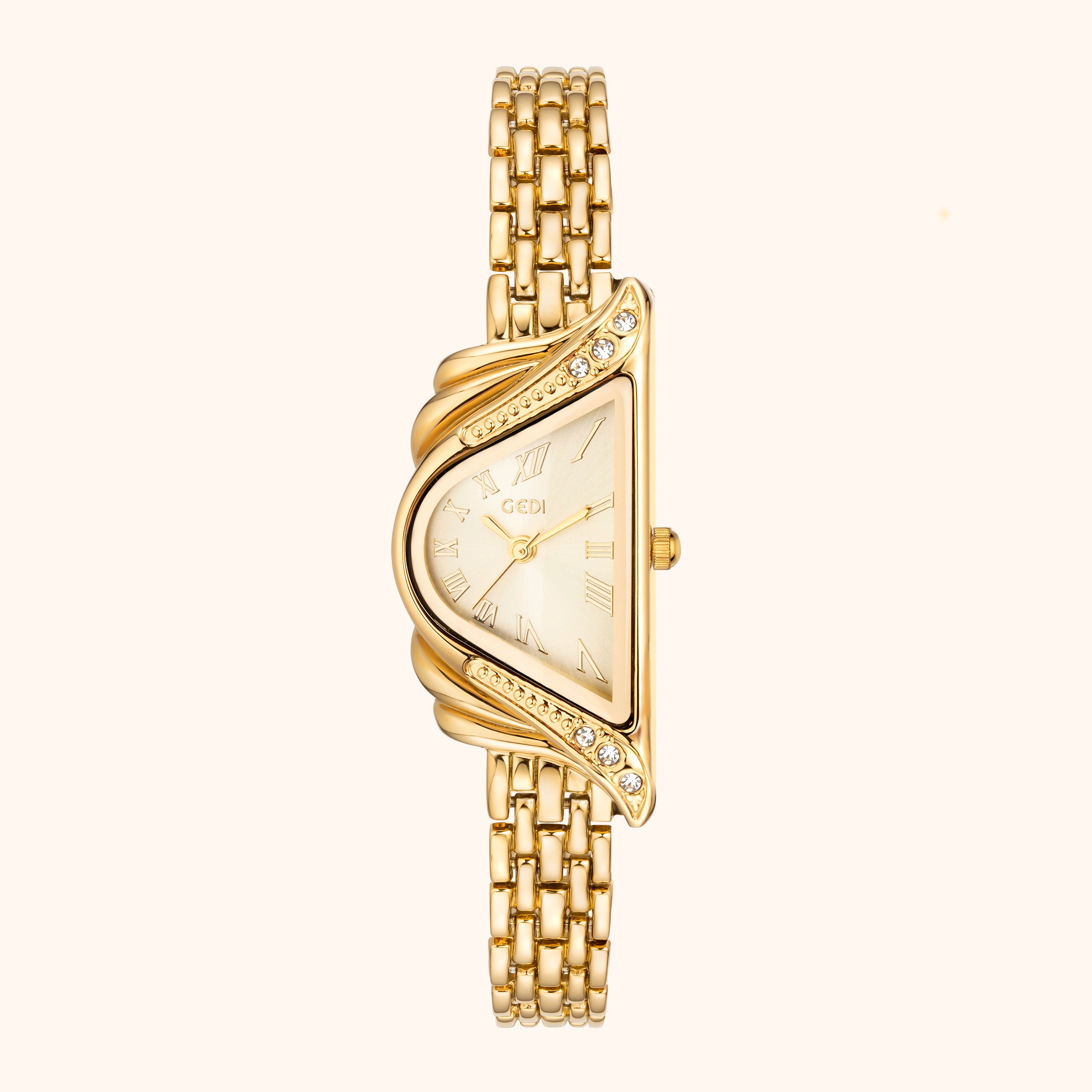 Gold watch with a decorative face on a white background