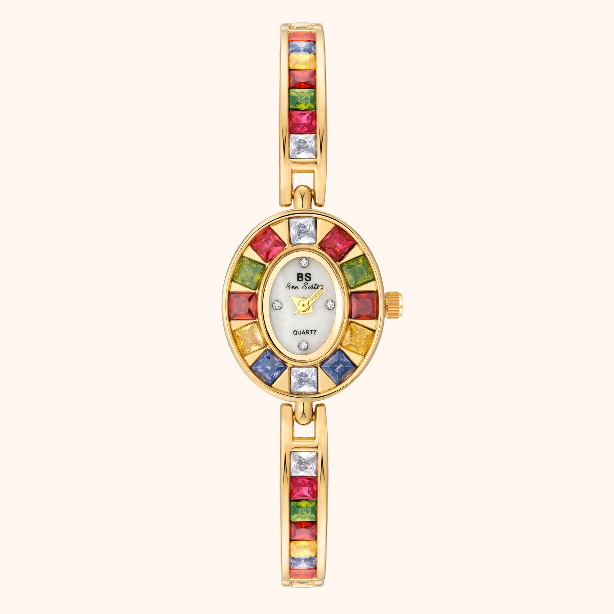 Gold watch with colorful gemstone bezel on a white background
