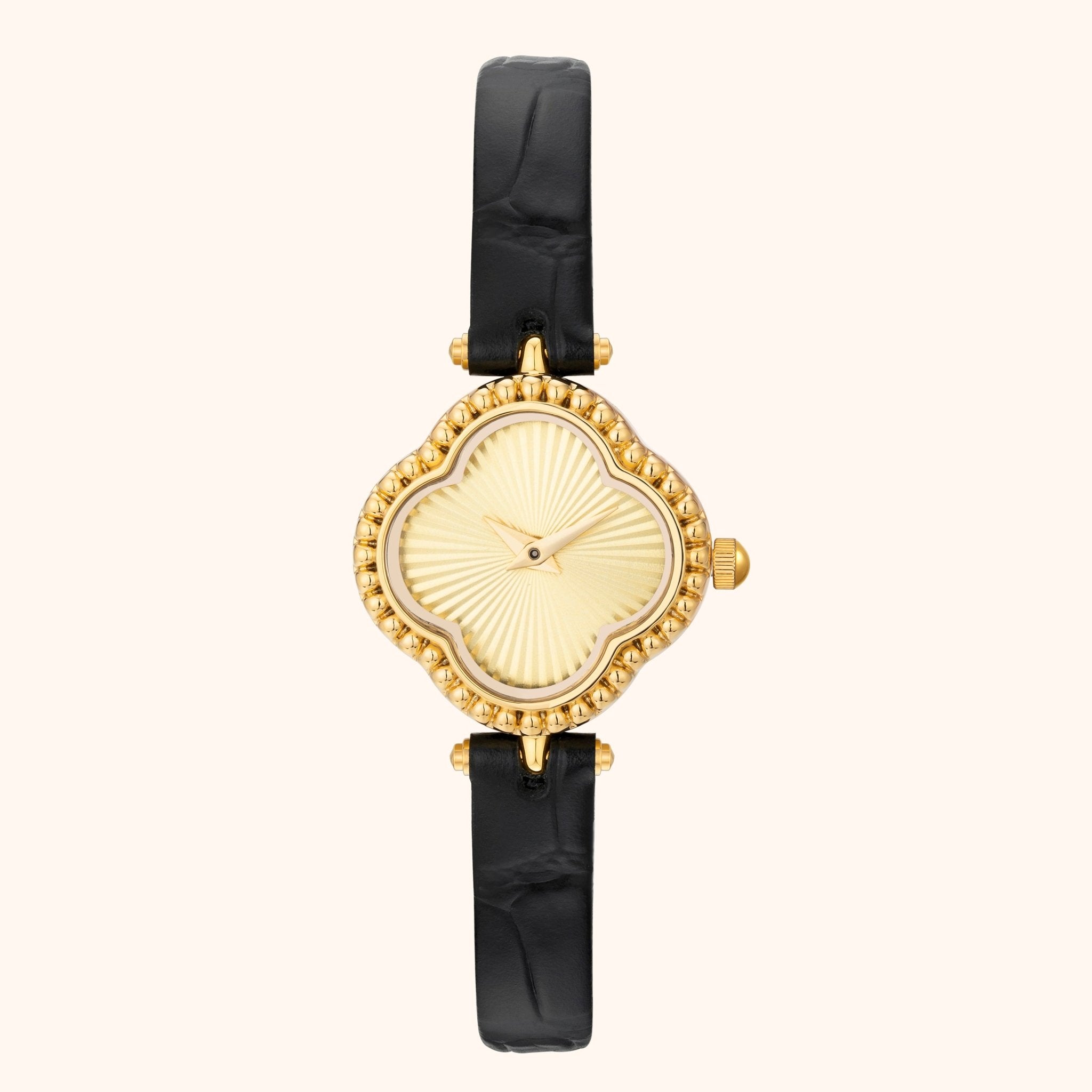 Gold watch with black strap on a white background