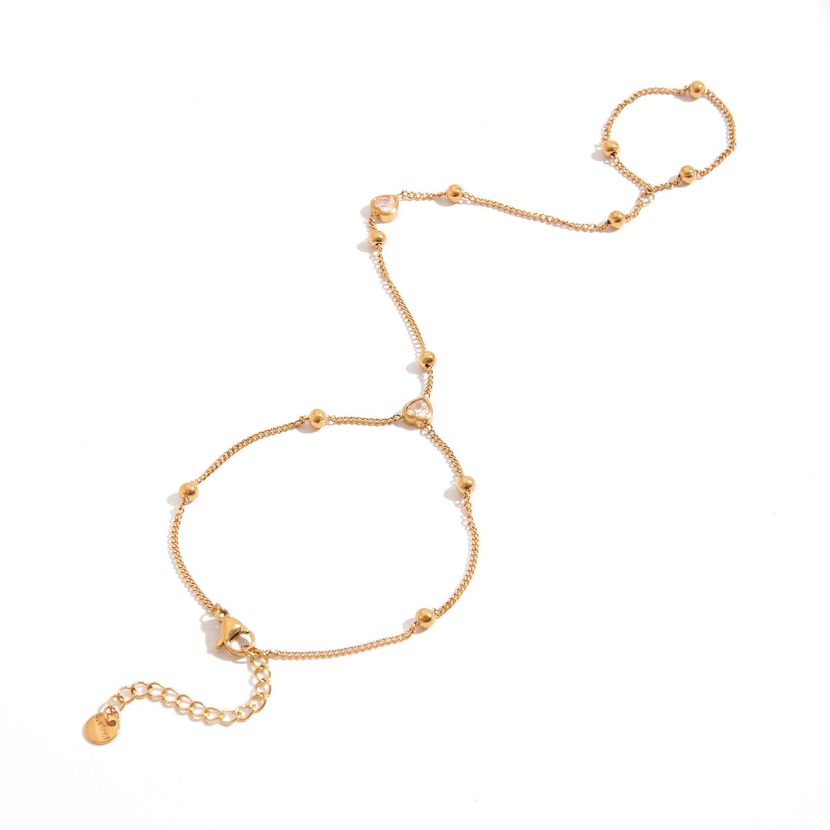 Gold hand chain bracelet on a white background