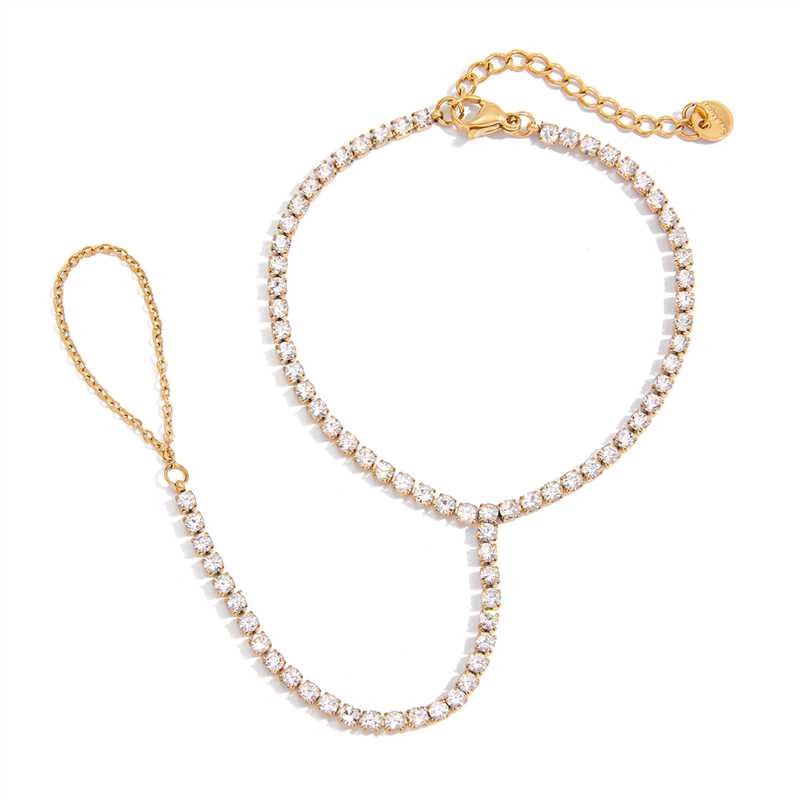 Gold necklace and bracelet set on a white background