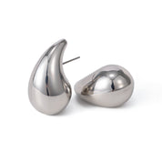 Pair of silver teardrop-shaped earrings on a white background