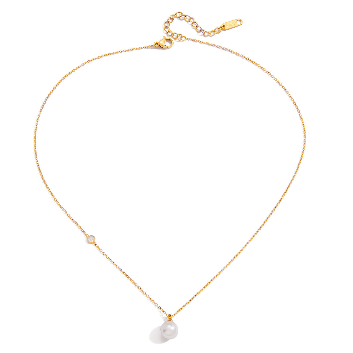 Gold necklace with pearl pendant on a white background