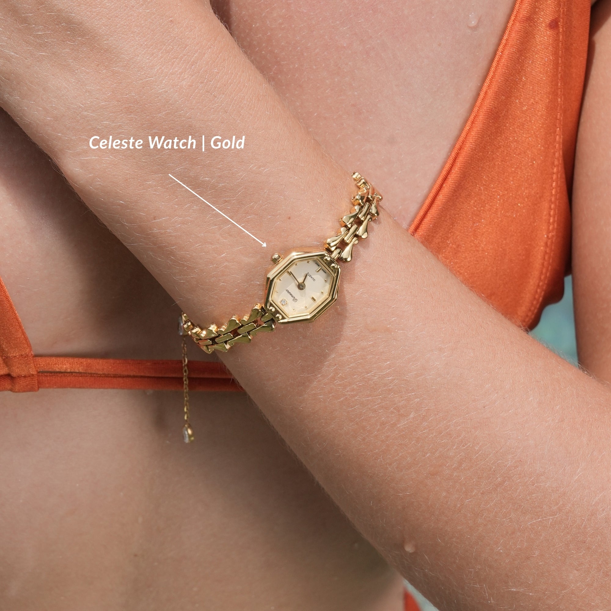 Gold watch on a wrist with 'Celeste Watch | Gold' text