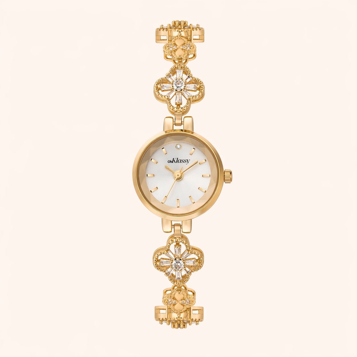Gold watch with decorative band on a white background